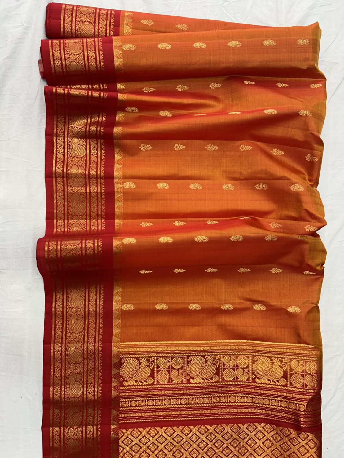 Mustard Orange Pure Silk Handloom Gadwal Pattu Saree with Red Contrast Border and Blouse